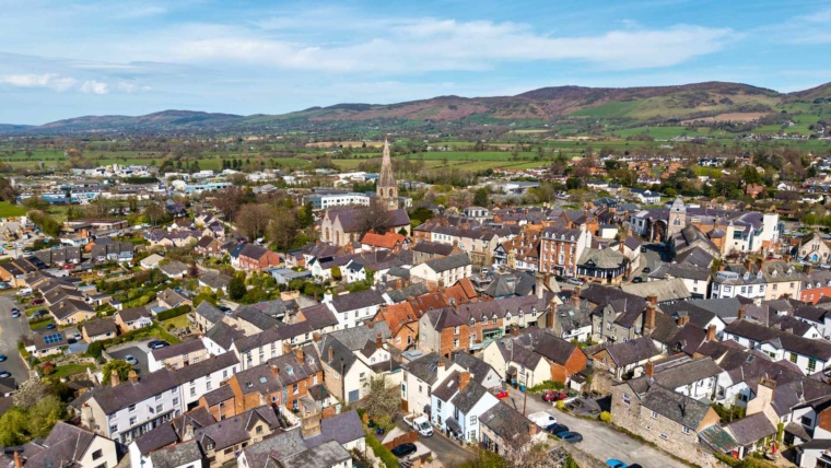 Aerial view of Ruthin in Denbighshire with the Clwydian Range behind, as rural full fibre broadband expands across North Wales.